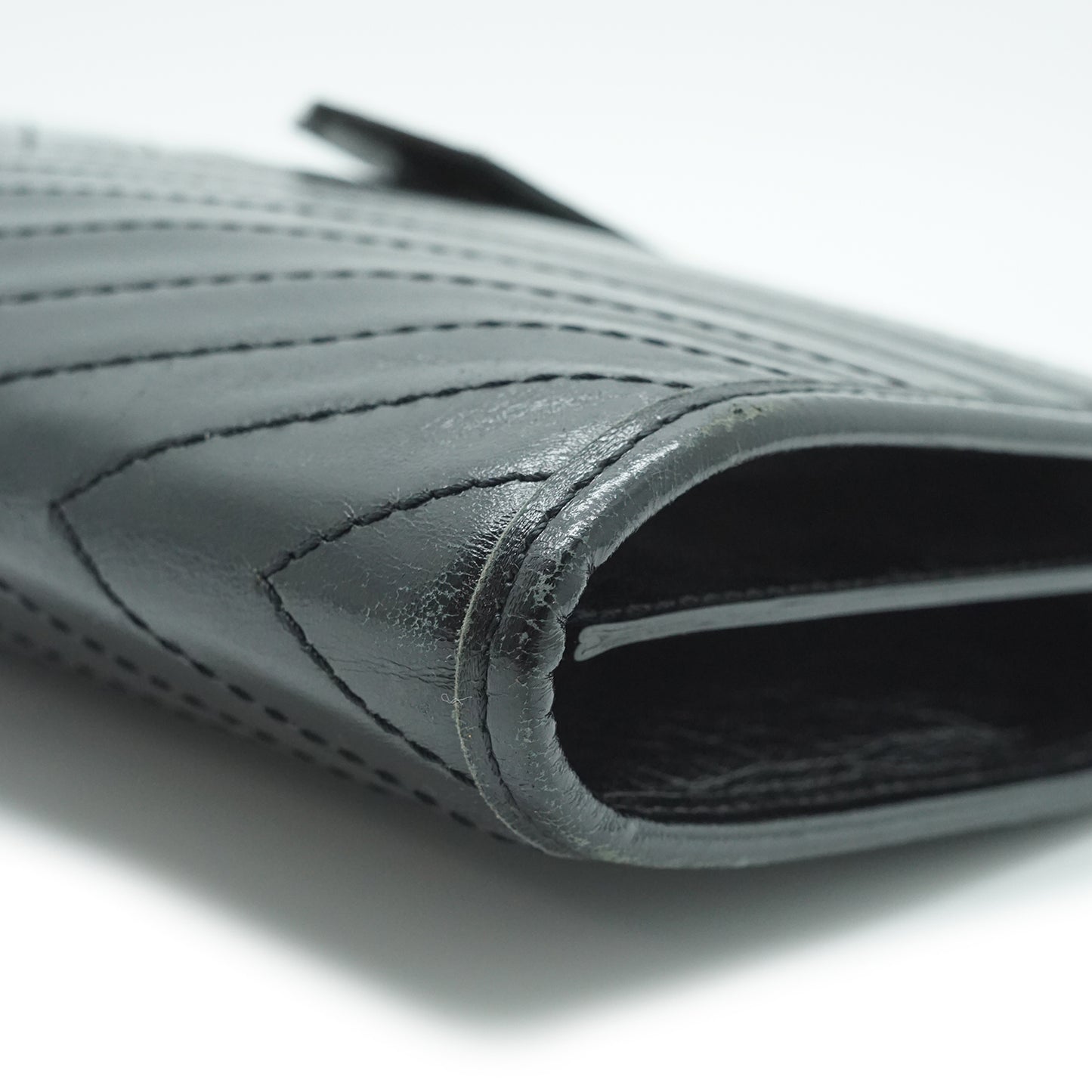 YSL Quilted Embossed Leather Clutch