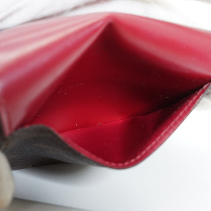 Monogram Portefeuille Zoe Fuchsia Compact Wallet